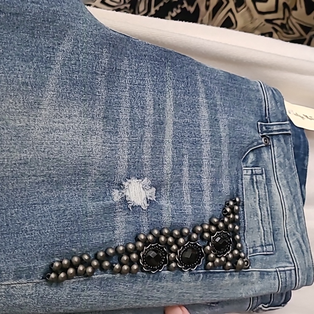 Designer jeans with side leg embellishments